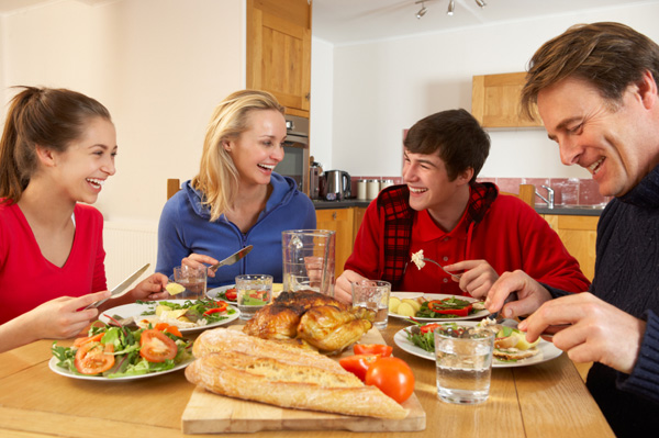 family-having-dinner-at-home-teens